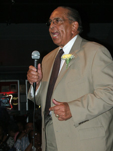 Clarence Williamson accepting plaque for Geraldine DeHass